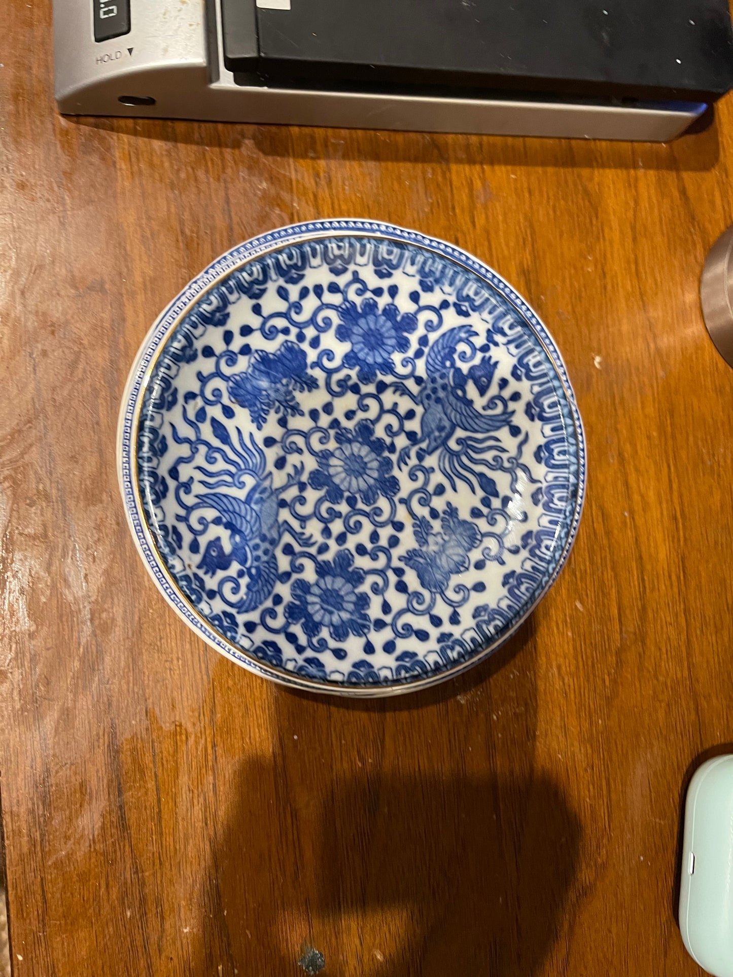 Four Small Blue and White Saucer Plates